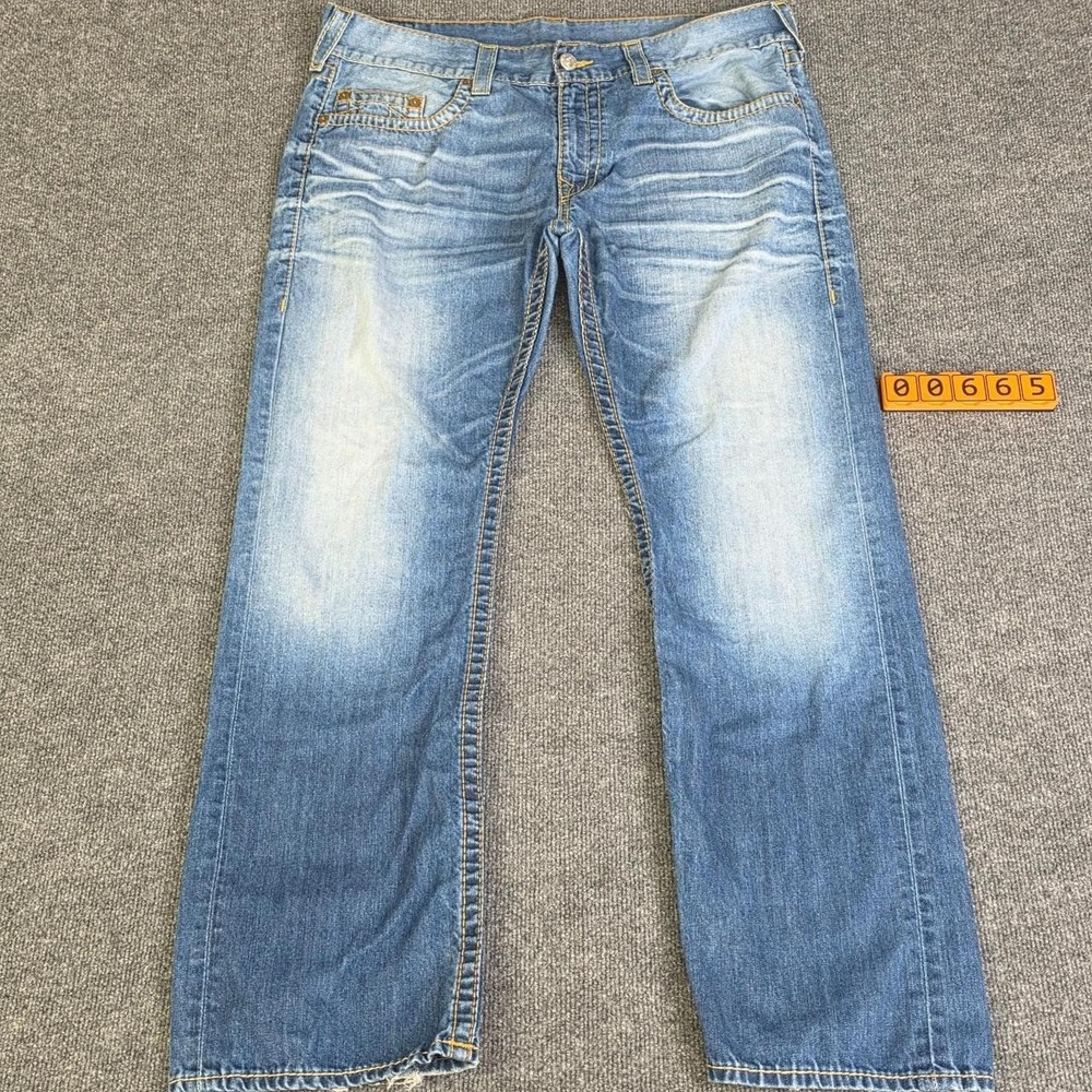 True Religion blue jeans size 38 Moderate wear on ankle hem
